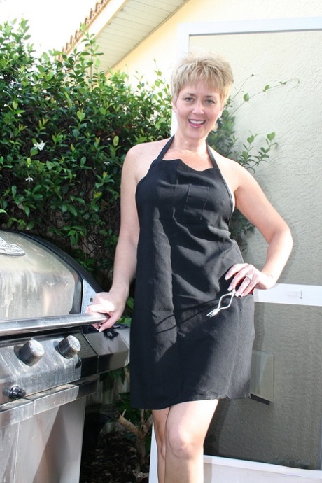 Mature female Tracy Lick heats up a sex toy on the BBQ before masturbating