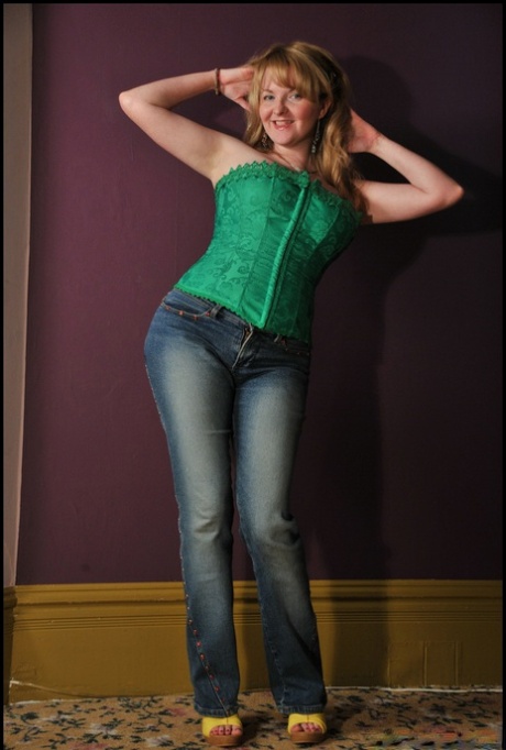 Mature amateur Tasty Trixie looses her big boobs from a corset in blue jeans