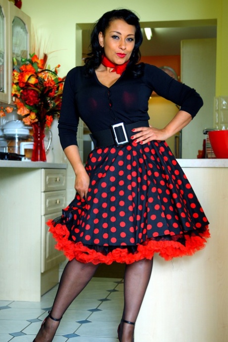 Brunette MILF Danica Collins exposes her big boobs and snatch in a kitchen