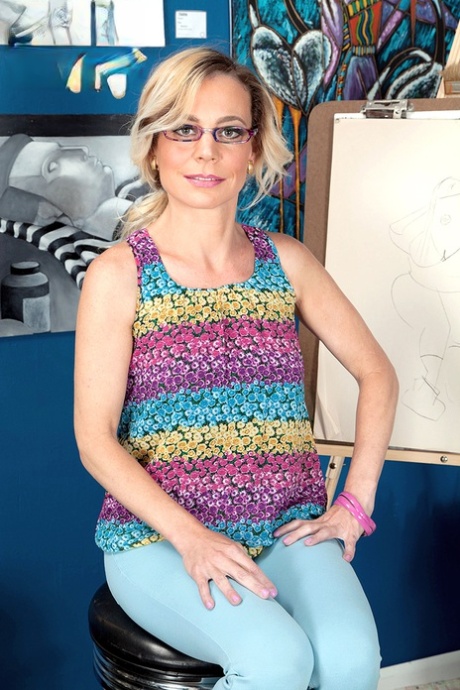 Hot mature in glasses Diandra loses her top to expose her tiny breasts