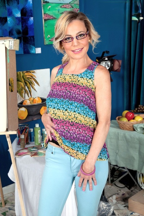 Hot mature in glasses Diandra loses her top to expose her tiny breasts