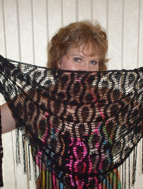 Mature wifey Busty Bliss posing in her exotic see through mesh top