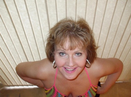 Mature wifey Busty Bliss posing in her exotic see through mesh top