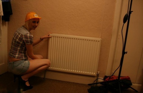 UK amateur Tracey Lain wears a ball cap and heels during POV anal sex
