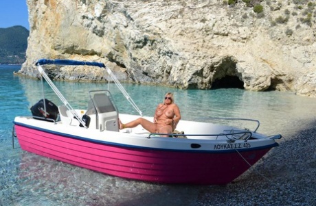 Beefy big Nude Chrissy pilots her boat naked to sun her round plump tits