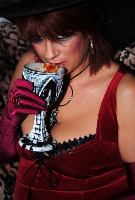 Sexy mature redhead Dimonty partakes in a pagan ritual in cosplay attire