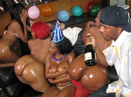 Busty ebony chicks suck and fuck a big black dick during a birthday party