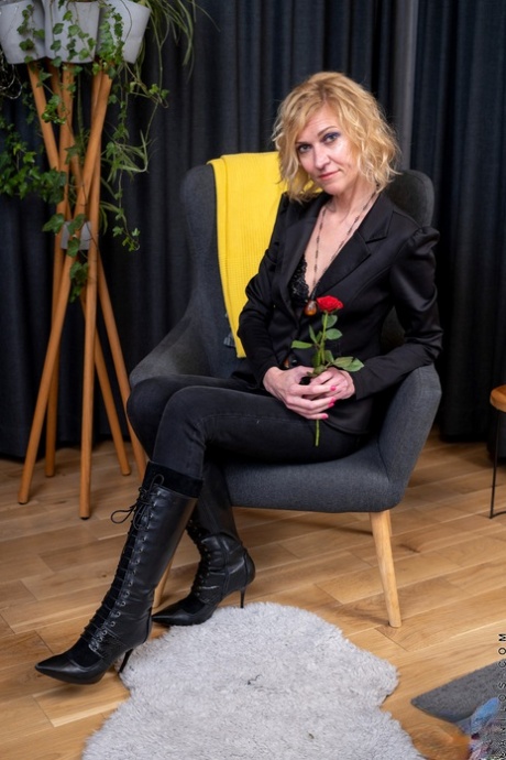 Blonde housewife Peggy puts her skinny body and pussy on display upon a chair