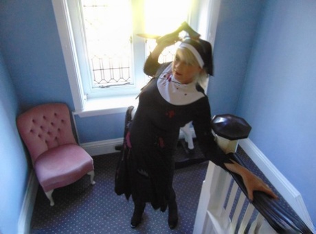 Mature amateur Dimonty removes a nun outfit while riding a hobbyhorse