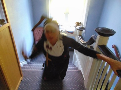 Mature amateur Dimonty removes a nun outfit while riding a hobbyhorse