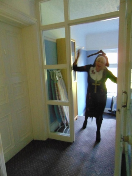 Mature amateur Dimonty removes a nun outfit while riding a hobbyhorse
