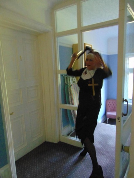 Mature amateur Dimonty removes a nun outfit while riding a hobbyhorse