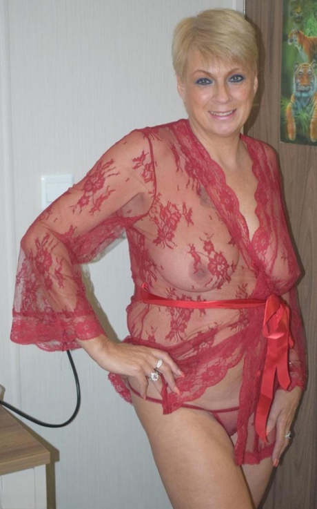 Mature blonde woman Dimonty looses her saggy tits from a sheer robe