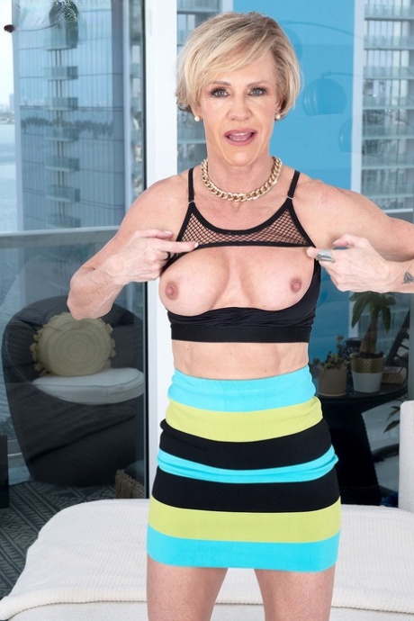 Mature woman with short blonde hair Anzee finger fucks in high heels