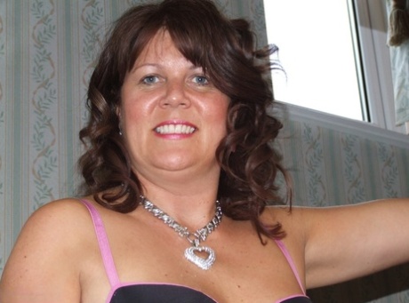 Thick older lady Cassandra Uk looses her tits and pussy from sensual lingerie