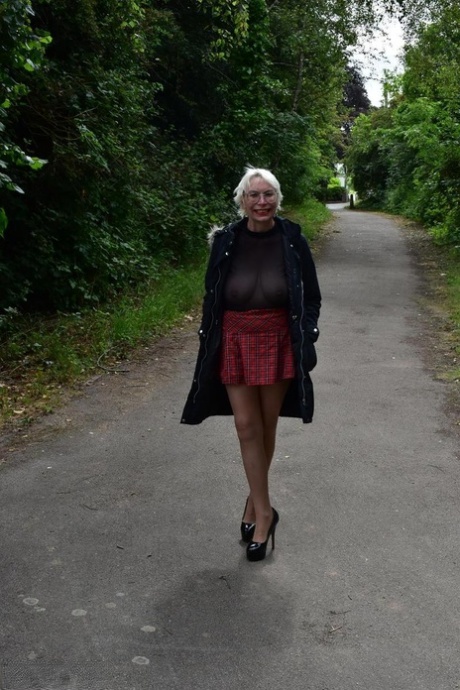 Mature British woman Barby Slut flashes her tits and ass in public places