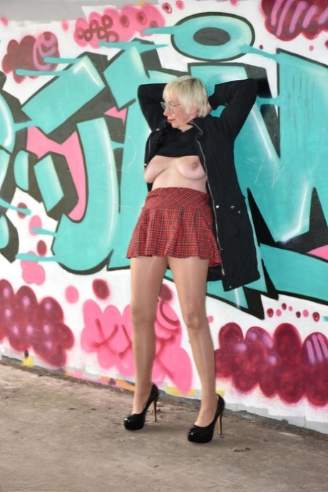 Mature British woman Barby Slut flashes her tits and ass in public places