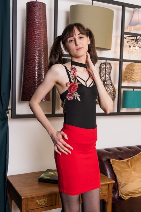 Solo girl Zlata removes her clothing while wearing a garter belt and nylons