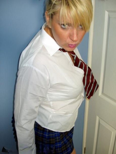 Older UK amateur Daniella English slides panties aside in schoolgirl attire