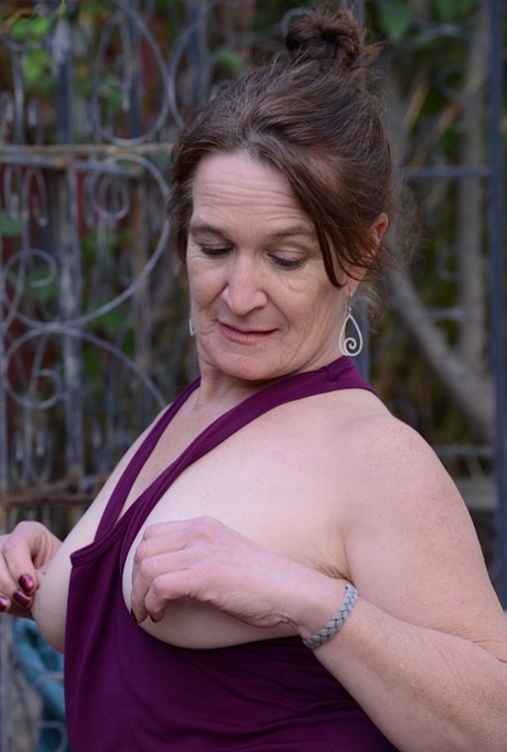 Mature slut Anna teases her shaved pussy and tight ass outdoor