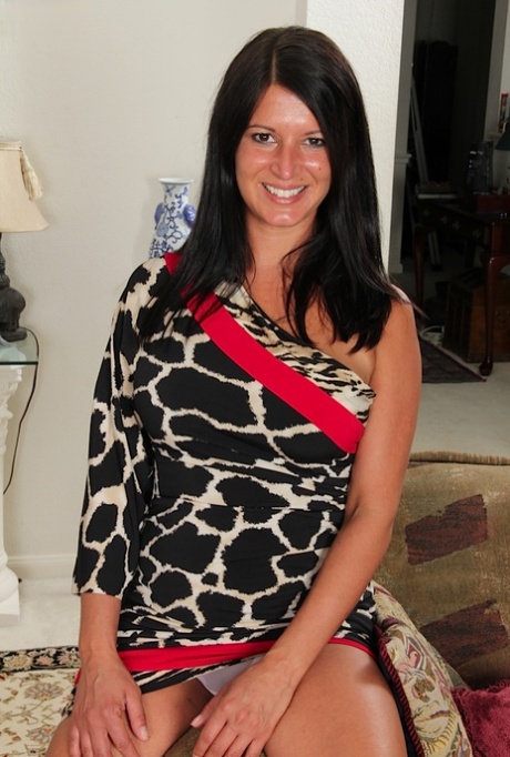 Brunette mature Veronica Jones undresses her sexy skirt in high heels