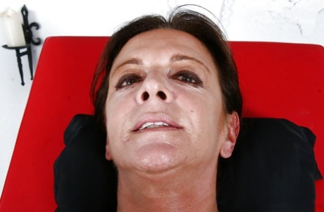 Older Euro woman Lady Sarah squirting for fetish photos while ball gagged