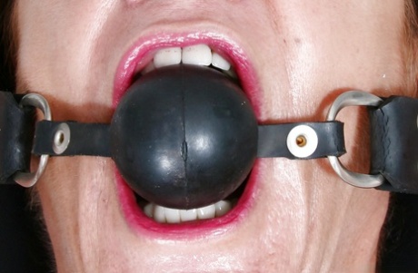 Older Euro woman Lady Sarah squirting for fetish photos while ball gagged