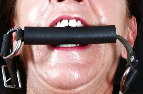 Older Euro woman Lady Sarah squirting for fetish photos while ball gagged
