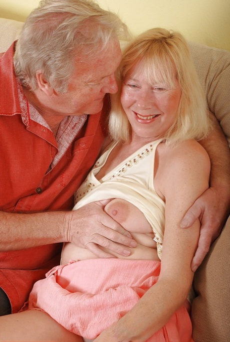 Plump older amateur Angeline swapping oral sex with her husband on sofa