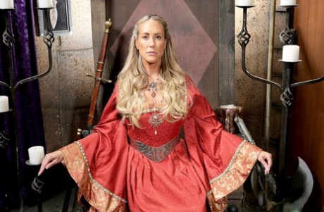 Mature blonde woman Brandi Love frees her big tits from cosplay costume