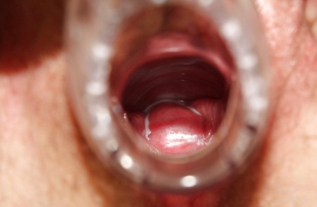 Chubby redhead granny masturbating her unshaven cunt in gyno office