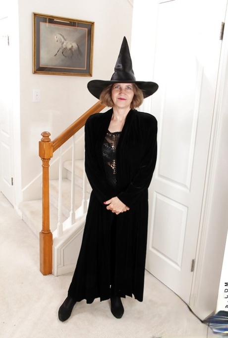 Smiley mature lady in cosplay outfit undressing and teasing her gash