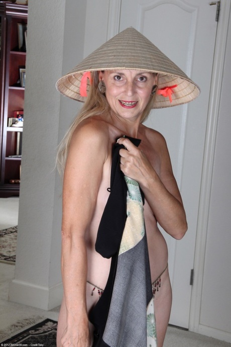 Sexy granny with tiny boobs Sienna unveils her hairy cunt and masturbates