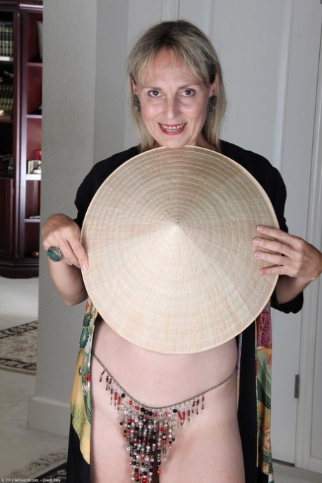 Sexy granny with tiny boobs Sienna unveils her hairy cunt and masturbates