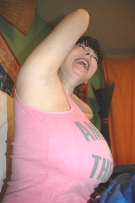 Dark haired amateur Lorna Morgan shows her huge boobs and stretches her ass