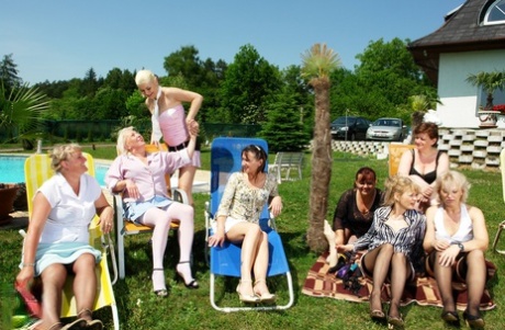 Young and mature European amateurs having a lesbian orgy in the backyard