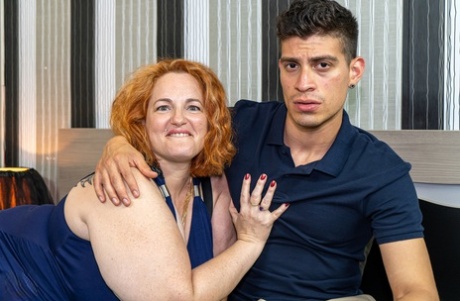 Redheaded BBW Sophia Lola gives a handsome boy a BJ in a 69 & rides his dick