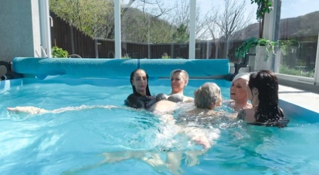 Insatiable Czech MILFs stripping and fucking in a poolside orgy